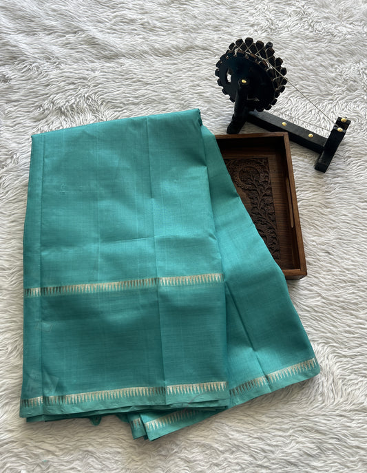 Mangalagiri Plain Pattu Saree Aqua Blue colored complemented with a mangalagiri Gap Border - Sampradaya Designer Studio