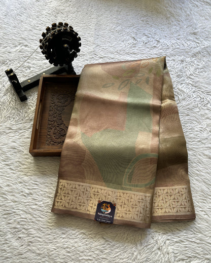 Banarasi Tissue Fancy Saree Sandcastle Colored Complemented with a Zari Border.