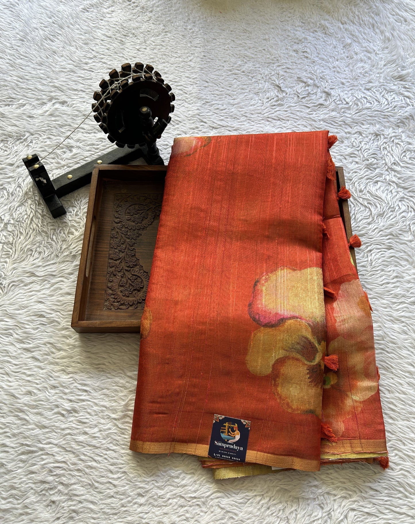 Banarasi Tissue Fancy Saree Dark Orange Colored Paired with a Borderless.