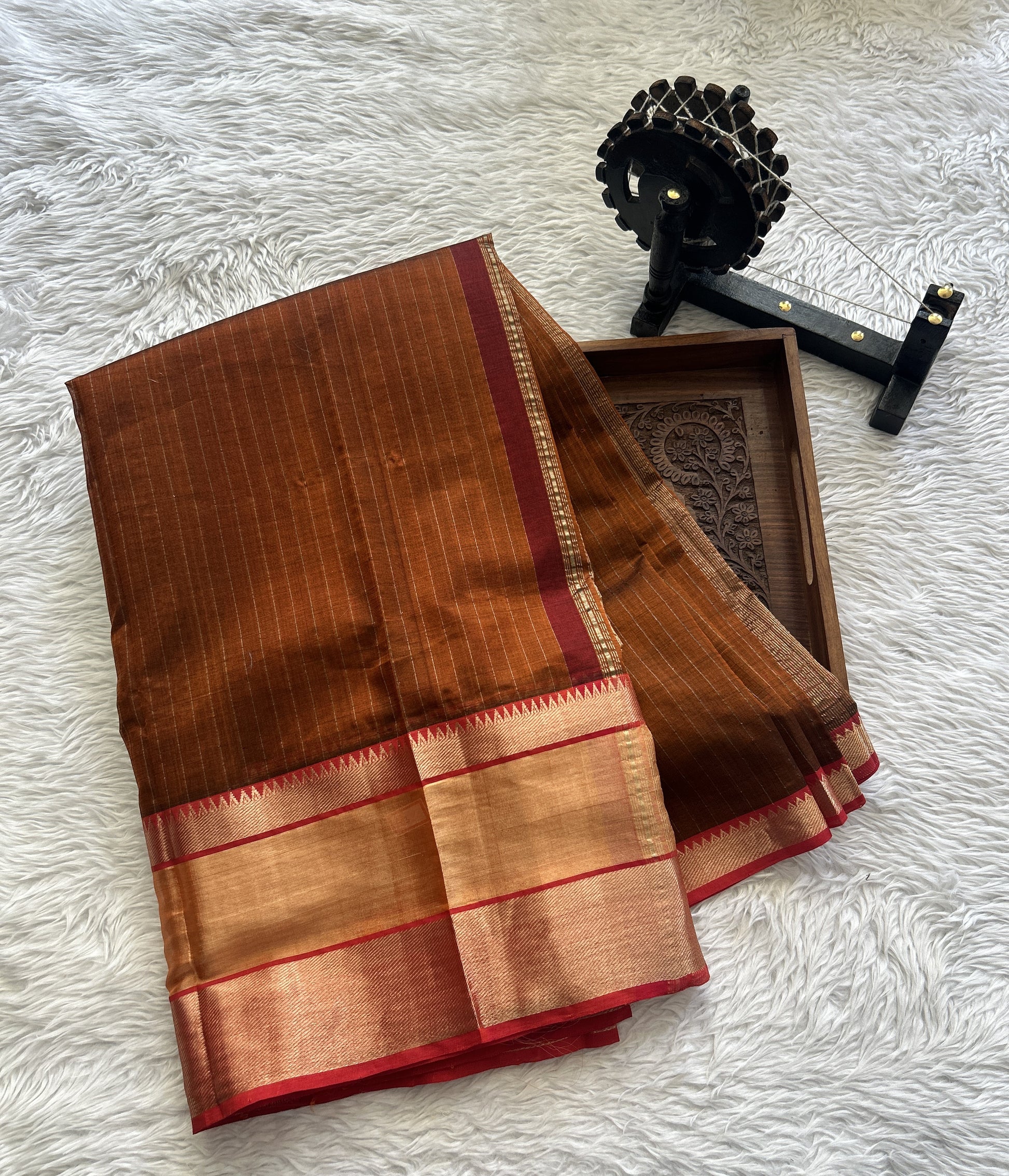 Mangalagiri Plain Pattu Saree Rust colored complemented with a Zari Border - Sampradaya Designer Studio