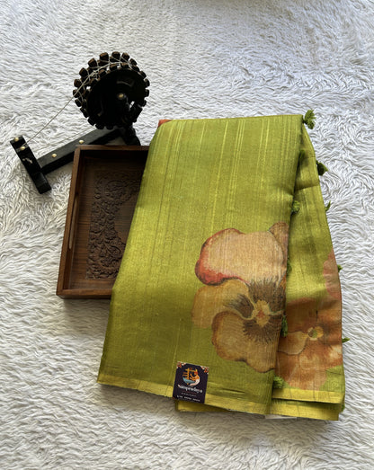 Banarasi Tissue Fancy Saree Parrot Green Colored Paired with a Borderless.