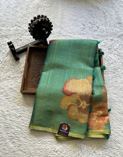 Banarasi Tissue Fancy Saree Rama Green Colored Paired with a Borderless.