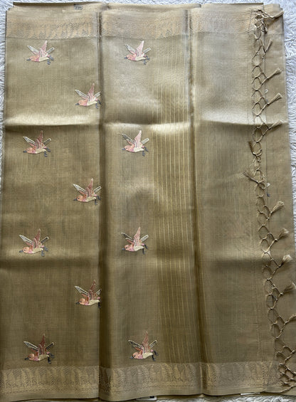 Banarasi Tissue Fancy Saree Biscuit Colored Paired with a Zari Border.