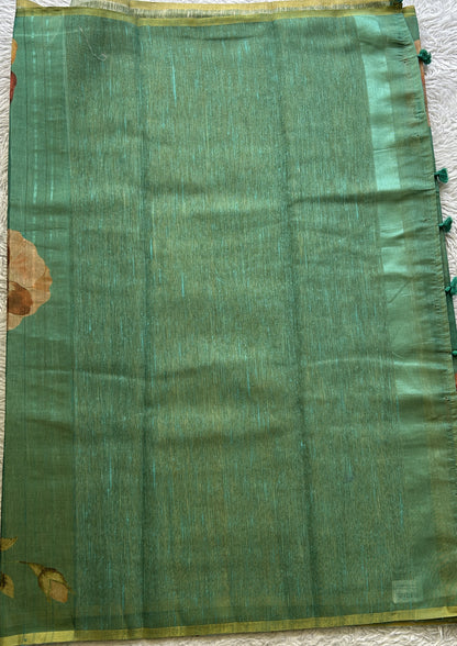 Banarasi Tissue Fancy Saree Rama Green Colored Paired with a Borderless.