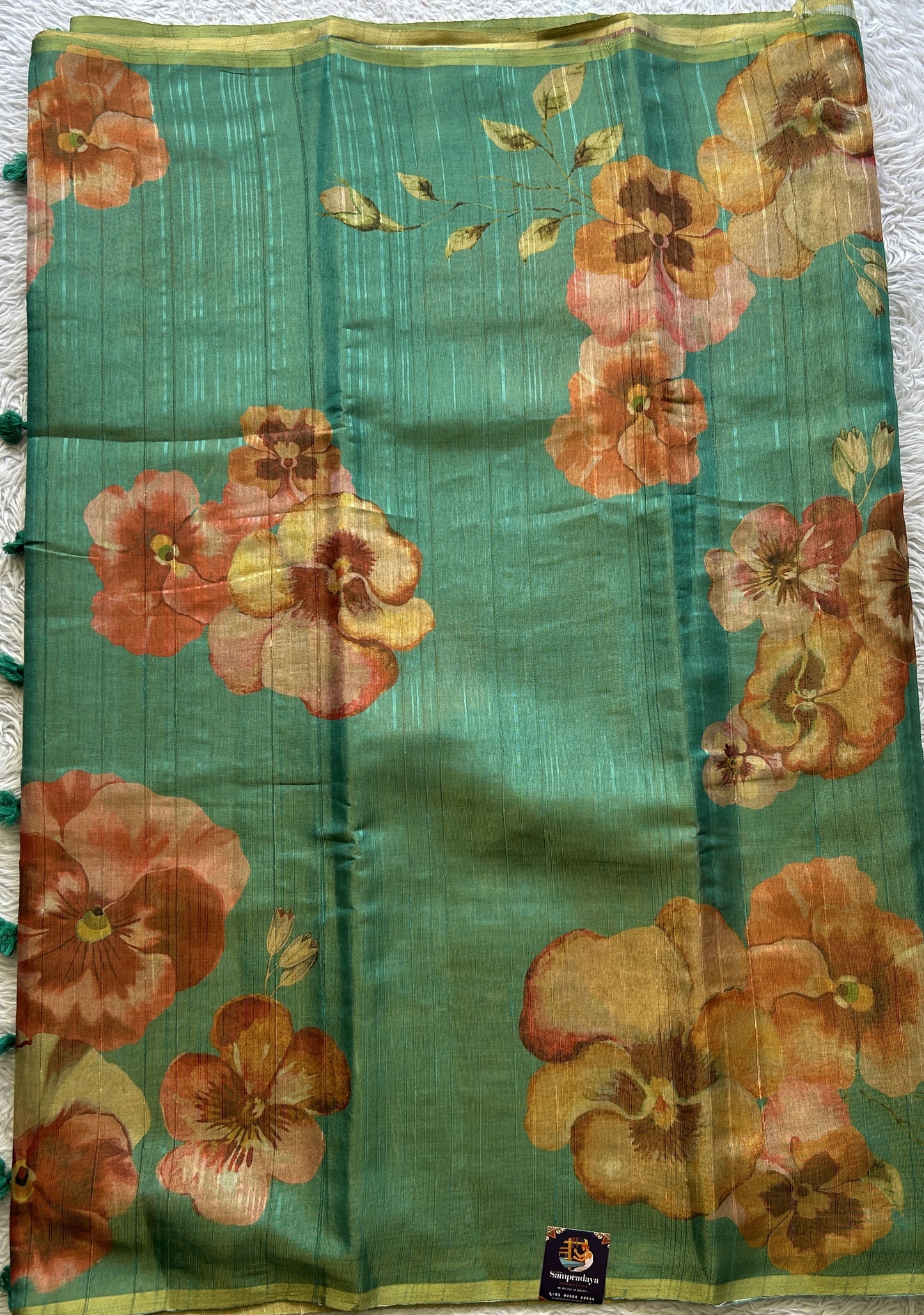 Banarasi Tissue Fancy Saree Rama Green Colored Paired with a Borderless.