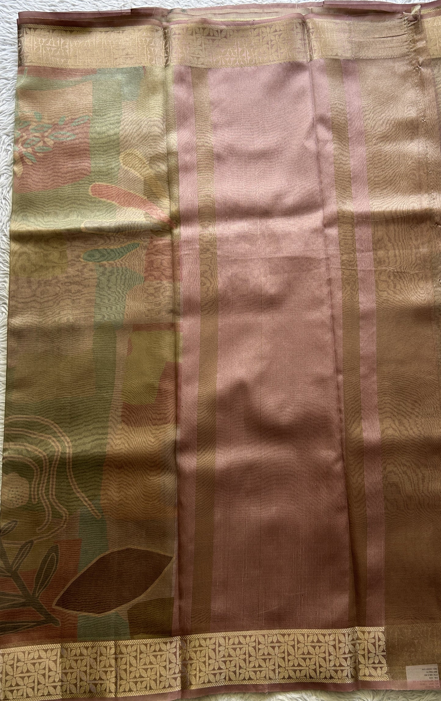 Banarasi Tissue Fancy Saree Onion Pink Colored Complemented with a Zari Border.