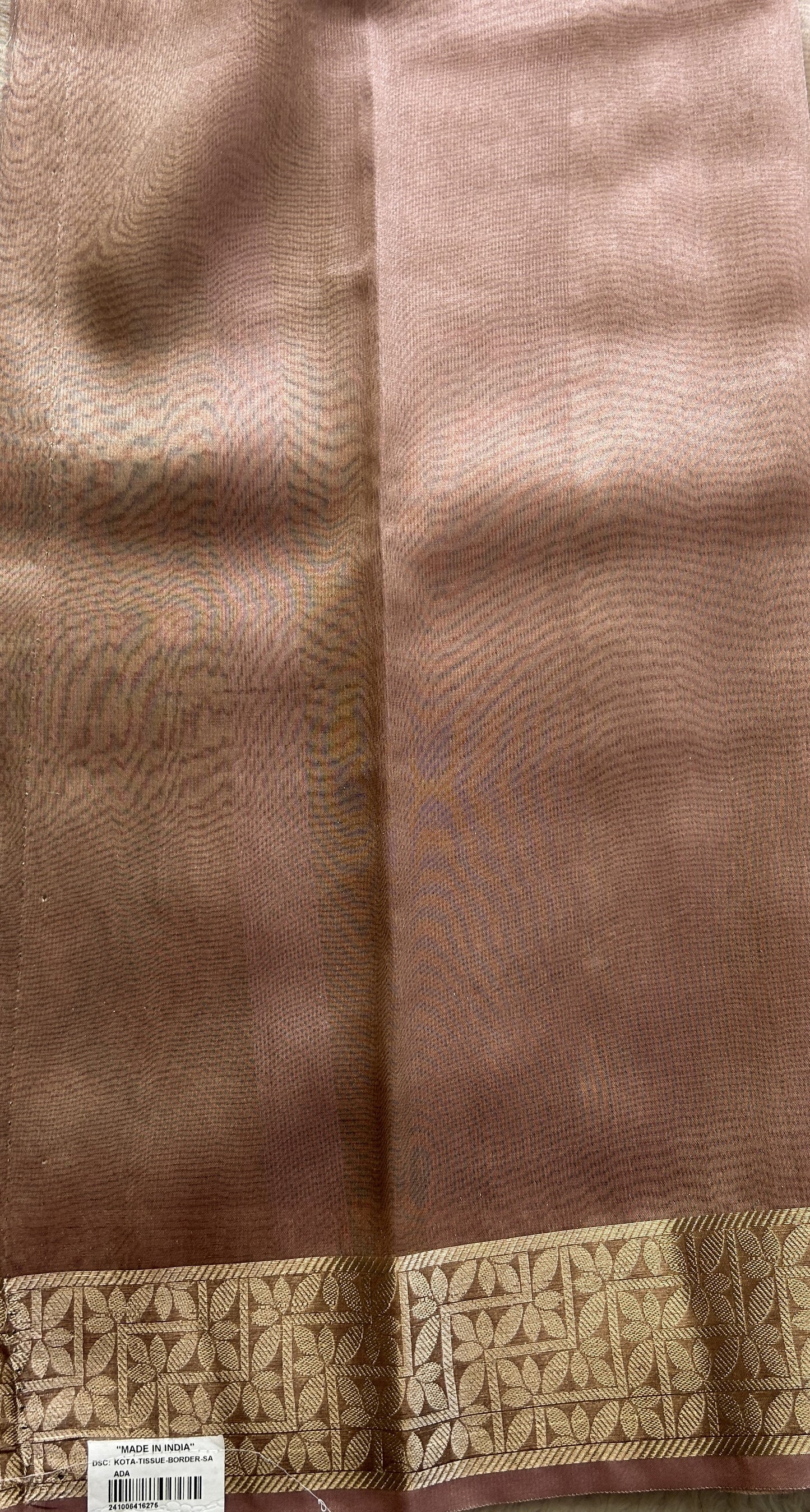 Banarasi Tissue Fancy Saree Onion Pink Colored Complemented with a Zari Border.