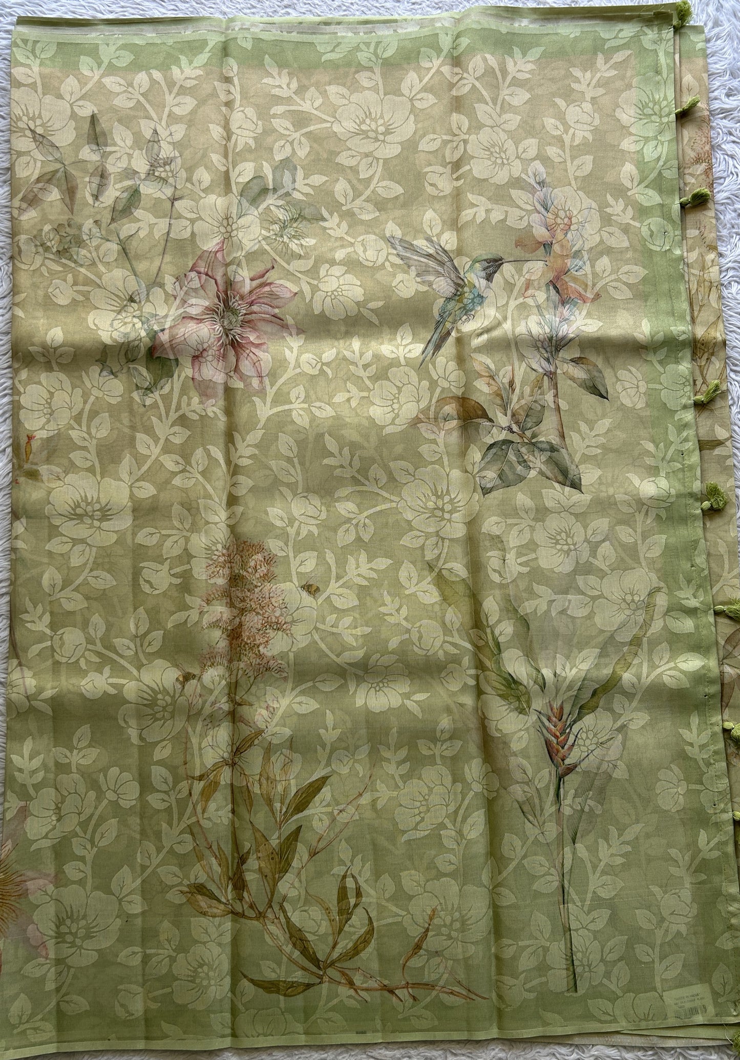 Banarasi Tissue Fancy Saree Light Green Colored Complemented with a Borderless.