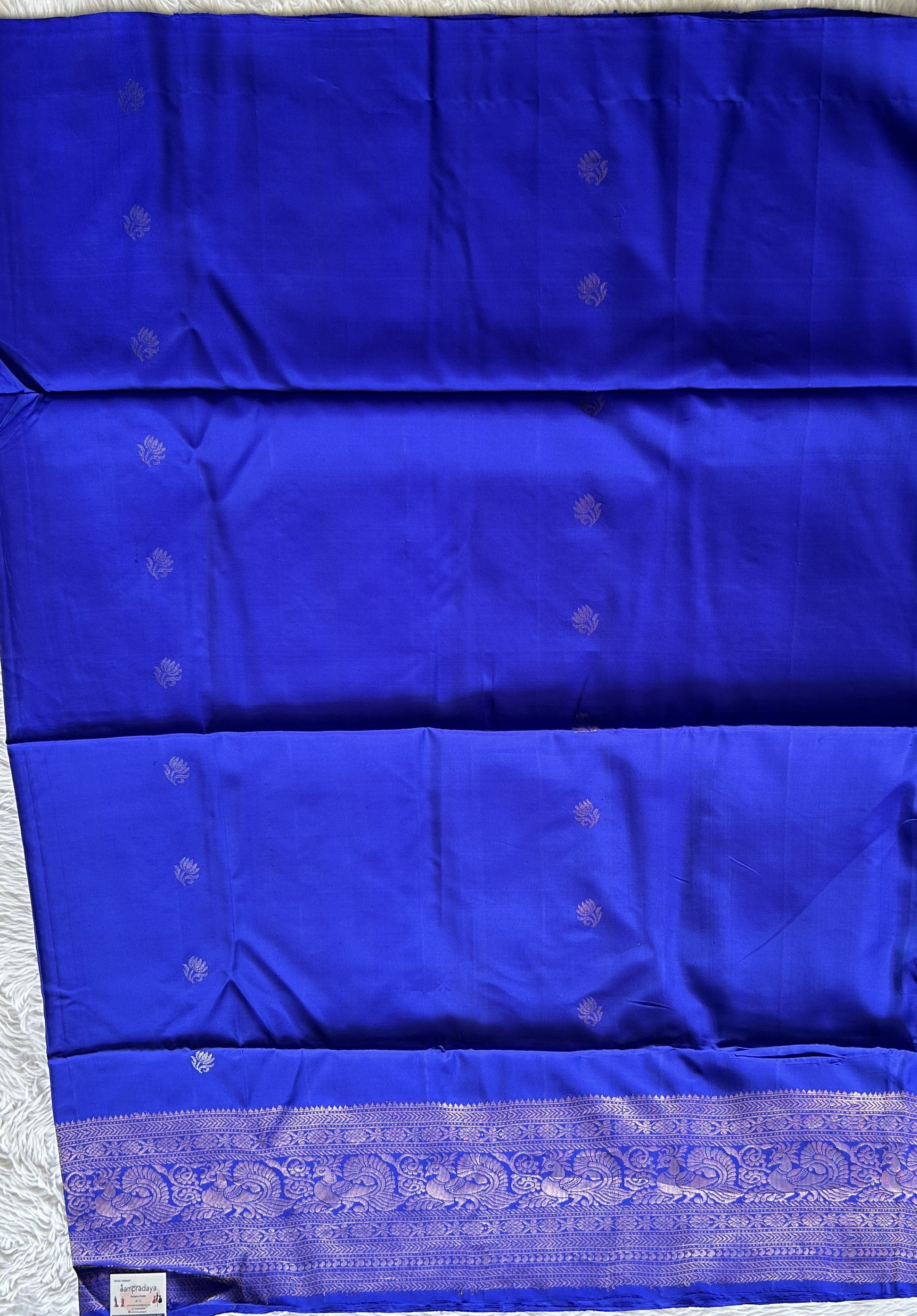 Pure Kanjivaram Soft Silk Saree Blue colored complemented with a Zari Border. - Sampradaya Designer Studio