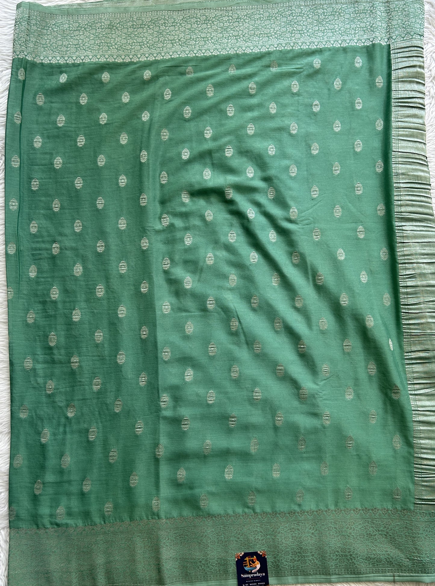 Semi Georgette Saree Aqua Green Colored Complemented with a Zari Border. - Sampradaya Designer Studio