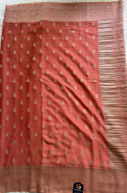 Semi Georgette Saree Peach Colored Complemented with a Zari Border. - Sampradaya Designer Studio