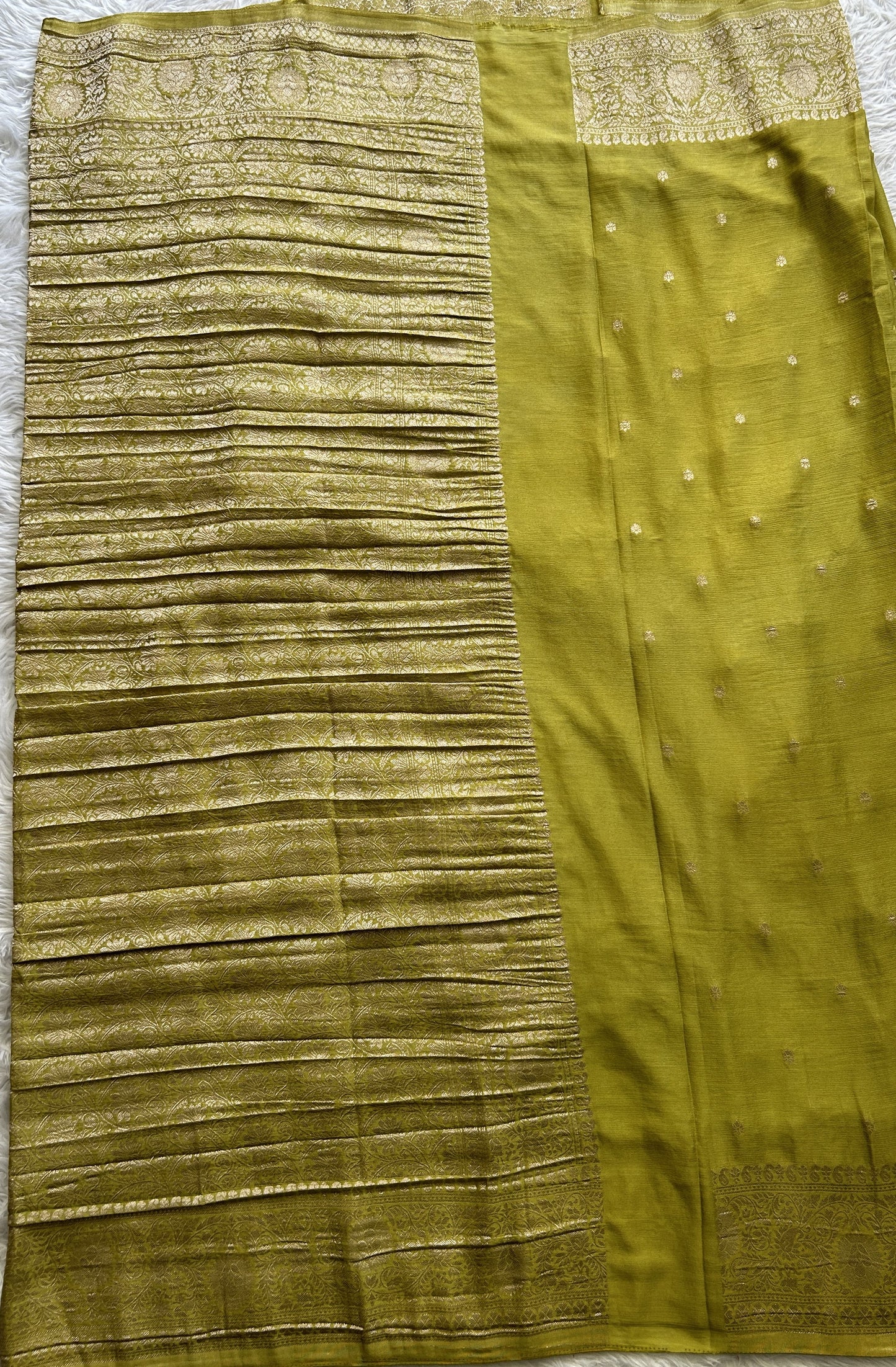 Semi Georgette Saree Dark Lime Green Colored Complemented with a Zari Border. - Sampradaya Designer Studio