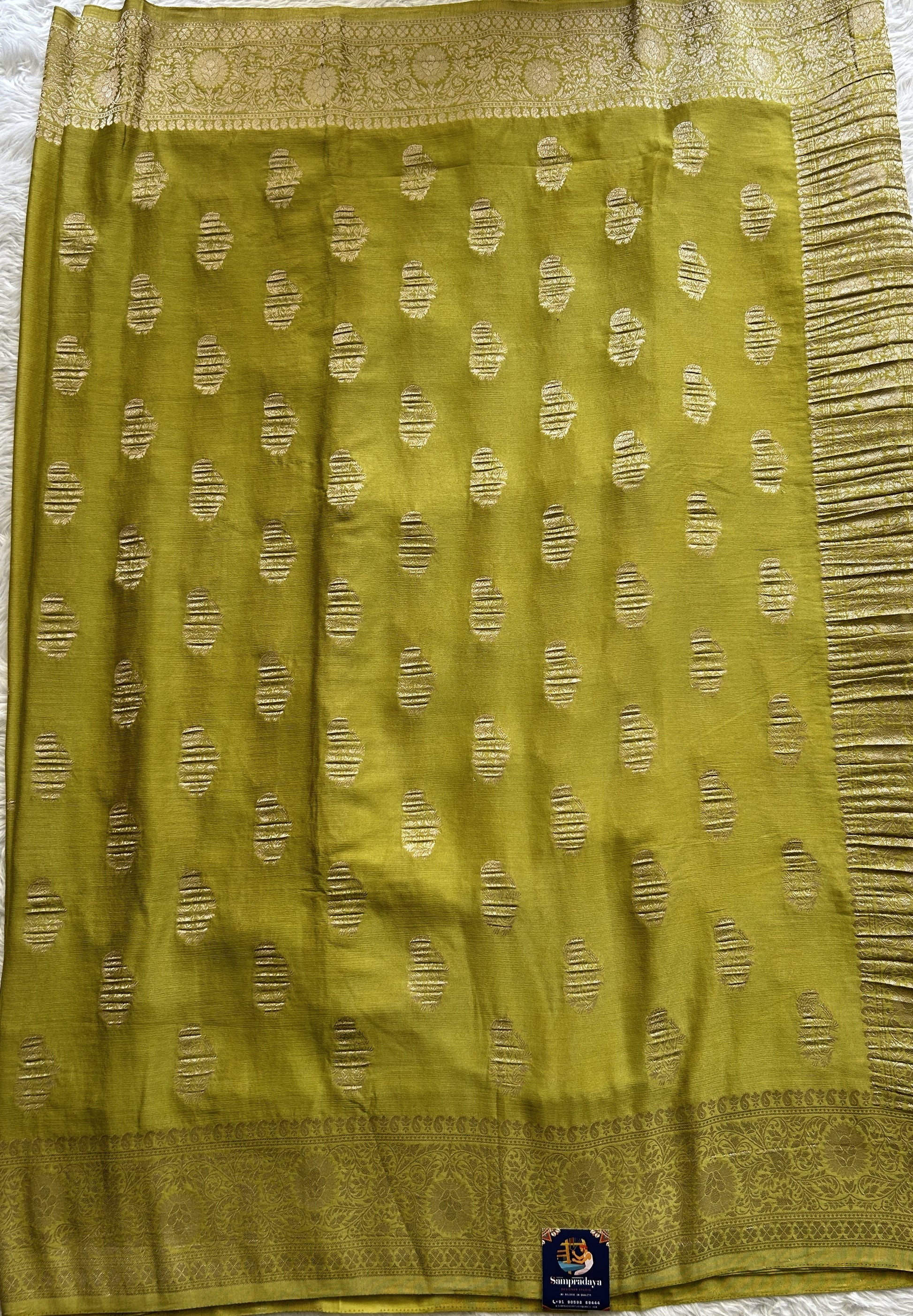 Semi Georgette Saree Dark Lime Green Colored Complemented with a Zari Border. - Sampradaya Designer Studio