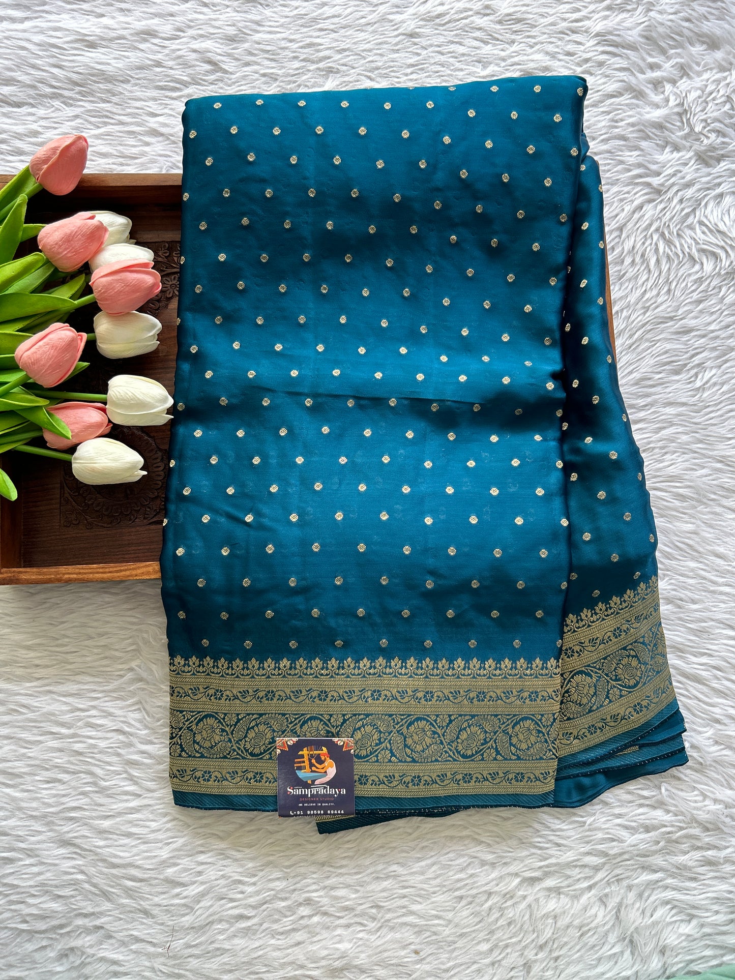 Satin Georgette Saree Peacock Blue Colored Complemented with a Zari Border. - Sampradaya Designer Studio