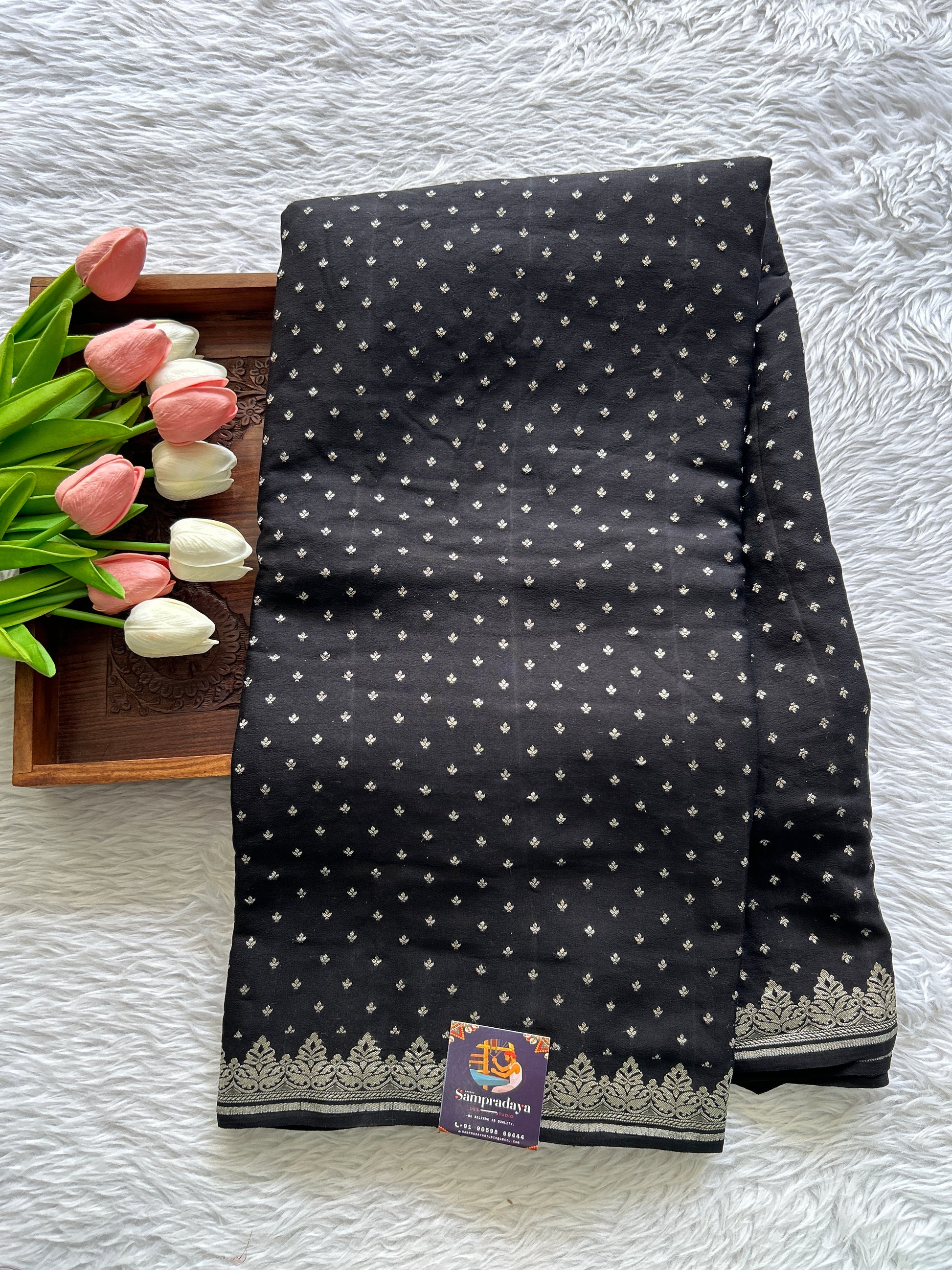 Banarasi Georgette Saree Black colored complemented with a Silver Zari border. - Sampradaya Designer Studio