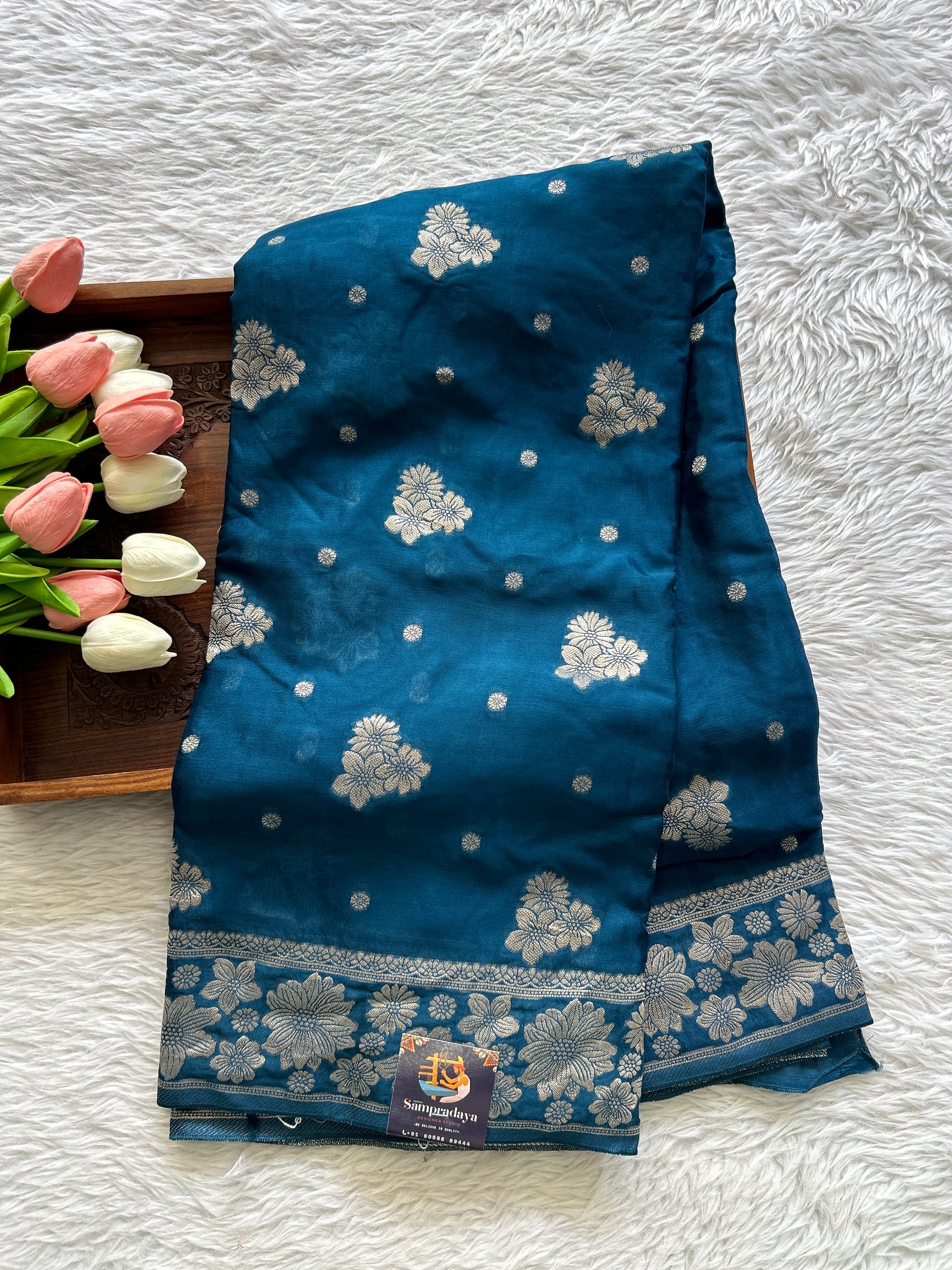 Viscose Georgette Saree Peacock Blue Colored Complemented with a Zari Border. - Sampradaya Designer Studio