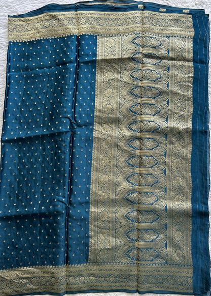 Satin Georgette Saree Peacock Blue Colored Complemented with a Zari Border. - Sampradaya Designer Studio