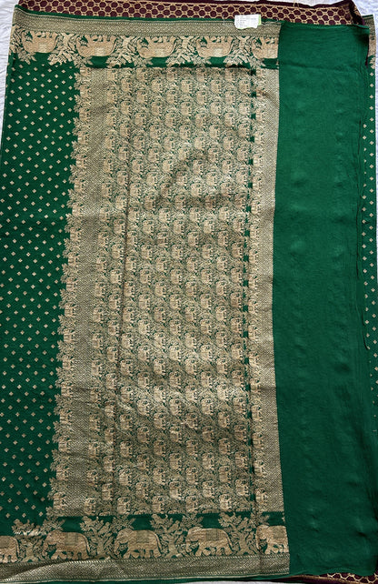 Banarasi Georgette Saree Green colored complemented with a Zari border. - Sampradaya Designer Studio